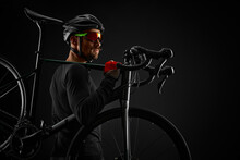 Male Cyclist With Road Bicycle On Black Background