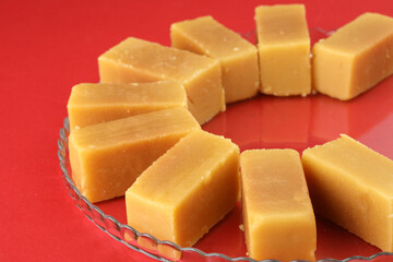 Mysore pak, a traditional, popular, and delicious sweet dish native to the city of Mysore, Karnataka, India, is made from ingredients like gram flour, ghee and sugar