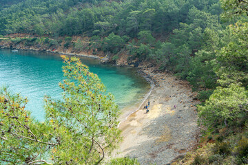 The Bay of Adrasan extends along more than 2.5 km of Antalya, naturally protected area, surrounded by a national park with pine forests, Taurus Mountains, blue water lagoons and sandy beaches.