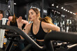 © SuperStock - A determined woman training in a gym fitness center running on treadmill working hard