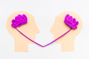 Teamwork concept, brain storm. Communication between two paper human heads