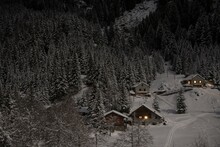 Alpine Village With Houses In Winter Landscape With Trees And Mountain In Ticino, Switzerland.