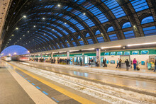 Railroad Station With A Train In Long Exposure In Milan, Lombardy In Italy.