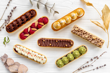 Wall Mural - Delightful set of eclairs with pistachio raspberries and chocolate