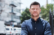 © Chanelle M/peopleimages.com - You can add experience to his list of skills. Portrait of a handsome mature businessman standing outside in the city.