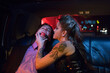 © SuperStock - Dominatrix and man wearing ball gag in limousine