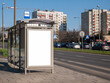 © Tomasz - Empty blank white cut out bus stop advertisement poster, vertical ad banner sign board, city advert on the street, urban public space advertising placeholder simple template, daytime, nobody