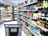 Fototapeta  - empty grocery cart in an empty supermarket