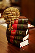 Knowledge of the law is crucial for a fair trial. Shot of legal books and a wig on top of a table.