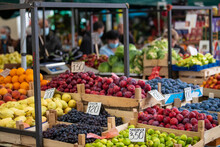 Open Air Street Market (pijaca) With Freshly Harvested Fruit In Belgrade, Serbia. Colorful Food, Healthy Lifestyle. Plums, Figs, Grapes, Pears, Peaches And Oranges.