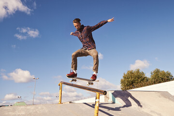 Sticker - Like flying. Shot of a skateboarder performing a trick on a rail.