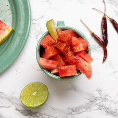 Wall Mural - Watermelon with chili powder and chamoy. Mexican food