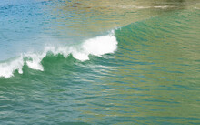 Surf Waves With White Water Crests Rolling In