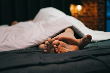 Young Asian couple on the bed