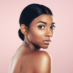 I have no doubt that my skincare regime is the best. Studio portrait of a beautiful young woman posing against a pink background.