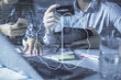 © peshkova - Double exposure of man and woman on-line shopping holding a credit card and brain hologram drawing. Ai and E-commerce pay on-line concept.
