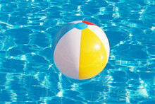 Colorful Inflatable Ball Floating In Swimming Pool