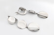 © Iryna - Luxury silver round earrings big jewelry for women isolated on white background, clipping path included