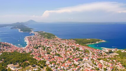 Fototapete - Copter flies over the old town Mali Losinj on the Adriatic coast. Filmed in 4k, drone video.