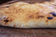 Traditional bulgarian dough stuffed with cheese on a wooden table