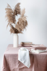 Fotomurales - Concept of romanitic Easter table with pampas and light pink tablecloth, selective focus image