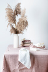 Fotomurales - Concept of romanitic Easter table with pampas and light pink tablecloth, selective focus image