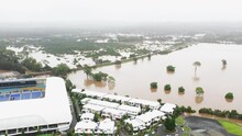 Aerial View Of The QLD Floods Coming Very Close To Houses Next To CBUS Stadium Robina Gold Coast QLD Australia