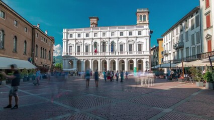 Canvas Print - Main square piazza Vecchia in an Italian town Bergamo timelapse. Library and historic buildings.