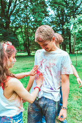 Canvas Print - young happy friends at holi fest