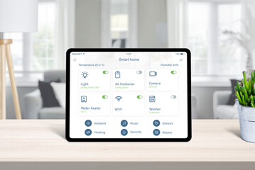 Wall Mural - Tablet with smart home app on home desk. Concept of home automatization conrol app with frequently used devices