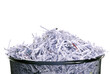 Leaving no shred of evidence. Studio shot of shredded paper in a dustbin against a white background.