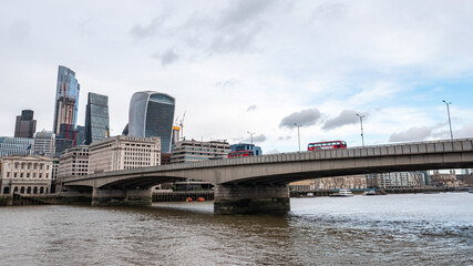 Wall Mural - London Bridge and the River Thames, London. A view over the towards the skyscrapers of the financial City of London district.