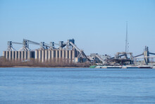 Large Grain Elevator And Barges On The Mississippi River