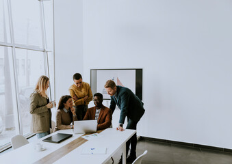 Poster - Group of multiethnic business people working together and preparing new project on a meeting in office