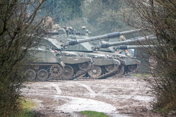 a row of parked British army FV4034 Challenger 2 main battle tank in action on a military exercise, Salisbury Plain Wiltshire UK