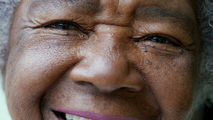 Wall Mural - A happy senior African woman macro closeup face smiling