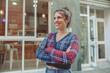 © Kostiantyn - Happy lady in cropped cardigan standing near cafe