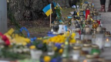 Commemorative Candles With Flowers In Blue And Yellow. Ukrainian Fallen Soldiers