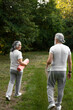 © Milana - Beautiful senior couple is practicing yoga in the nature
