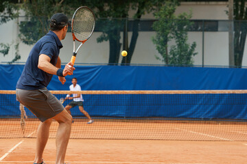 Poster - Their friends and great rivals on the court. Two male tennis players on the court.