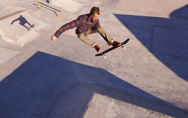 Sticker - A rad day at the skate park. A young man doing tricks on his skateboard at the skate park.