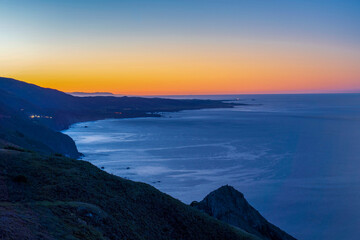 Sunset, sunrise over the ocean, mountains, coast