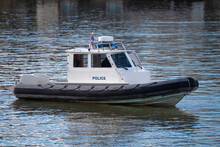 Police Coast Guard Motor Boat On Water Surface. Police Patrol Boat On The River In Action. Emergency Response