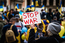 Elderly Woman Holds Stop War Sign At A Demonstration In Support Of Ukraine Against Russia