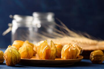 Cape gooseberry fruit from local market on blue background, Tropical fruit in spring summer and autumn season