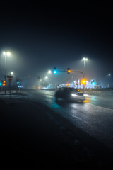 Wall Mural - car on city street in dark and foggy night