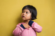 © dwi - Asian Little girl with sore throat touching her neck
