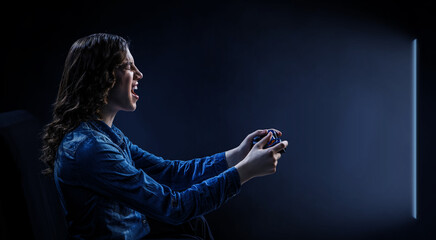 Poster - A woman in headphones with a controller set aside in her hands