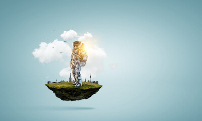 Wall Mural - spaceman on a light bulb