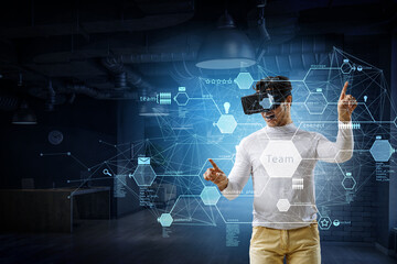 Wall Mural - man wearing virtual reality goggles